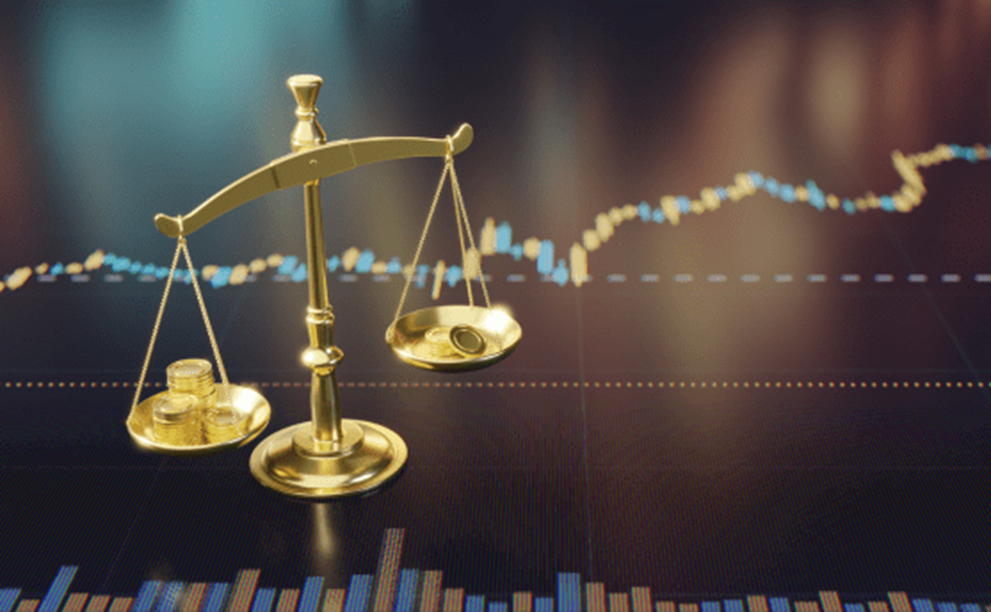Gold scales in front of a line graph.