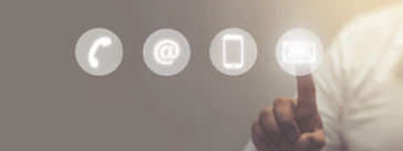 Someone pressing an icon of an envelope in a row next to icons of a phone, @ symbol, and a cellphone.