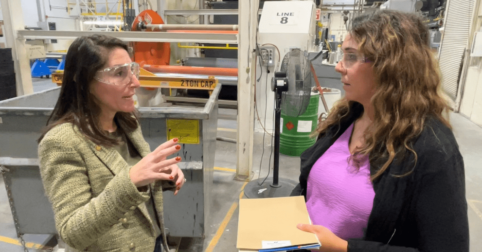 President Hammack asks Jessica Little, a process engineer at Seaman Corporation, a question during a tour. (October 4, 2024)