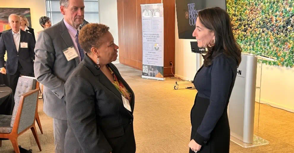 Hammack chats with meeting attendees following the discussion (December 3, 2024)