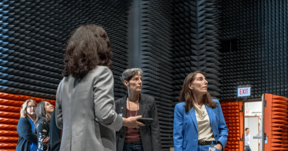 Hammack (right) and Lisa Barrow (second from right), vice president of regional analysis at the Cleveland Fed, learn about one of Glenn Research Center’s newest testing spaces for long-range communications technology. Work in this facility supports the Artemis mission and infrastructure for other innovations like air taxi services. Fun fact: NASA’s Glenn Research Center holds an Emmy for its work on early satellite TV.