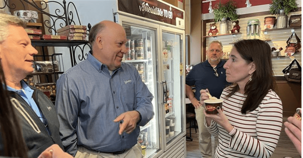 Chip Graeter (left), chief of retail operations at Graeter’s, and Rich Graeter (center), president and CEO, talk with Hammack about the business’s outlook.