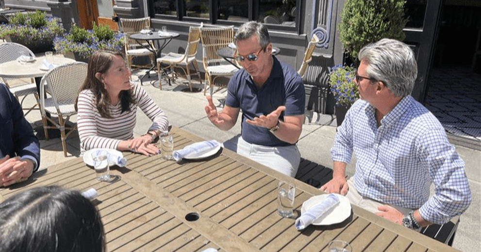 Hammack talks with Thunderdome Restaurant Group owners John (left) and Joe (right) Lanni on the patio of one of their establishments, Pepp and Dolores.