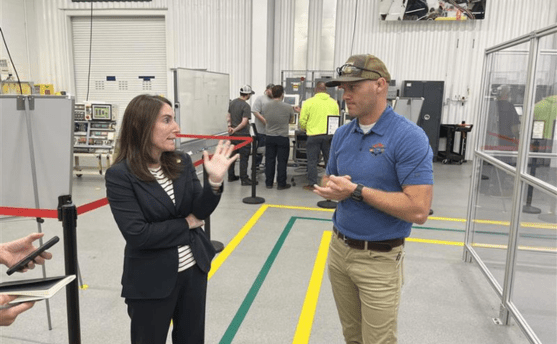 Hammack asks TMMK’s Carter Hall about robotics training at the Toyota Maintenance Training Center.