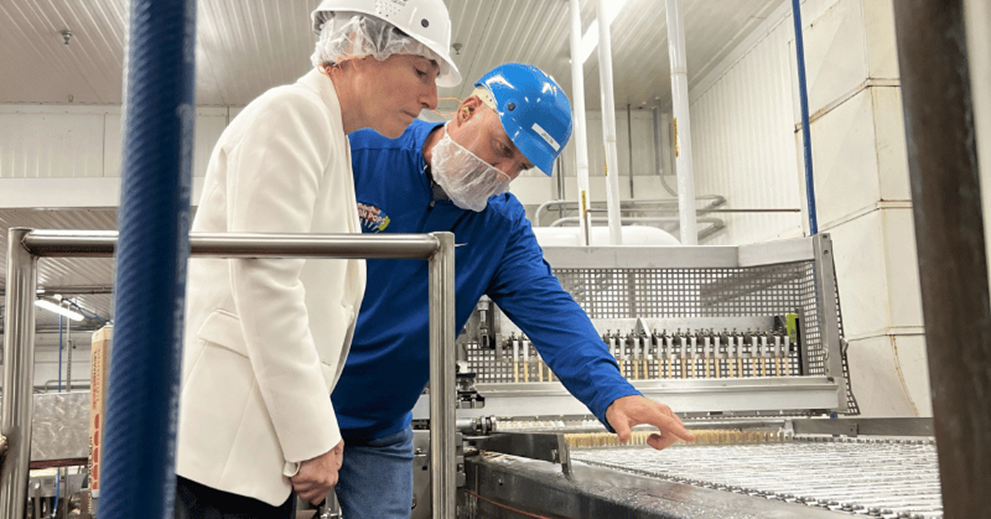 President Hammack learns more about the dipping process for Ziegenfelder’s frozen treats.