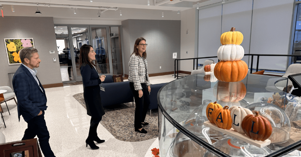 A group of people walking in a cafe setting