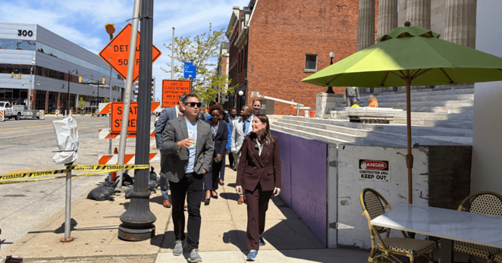 Hammack chats with Drew Whiting, CEO of the Erie Downtown Development Corp., while walking past the Erie Art Museum. The museum is currently undergoing historic preservation work.