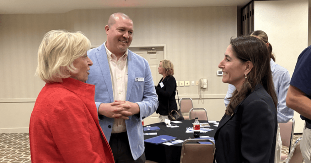 Hammack chats with two Greater Sandusky Partnership attendees—Lee Alexakos, director of public affairs, and Matt Lasko, chief development officer—following the Sandusky business leader roundtable.