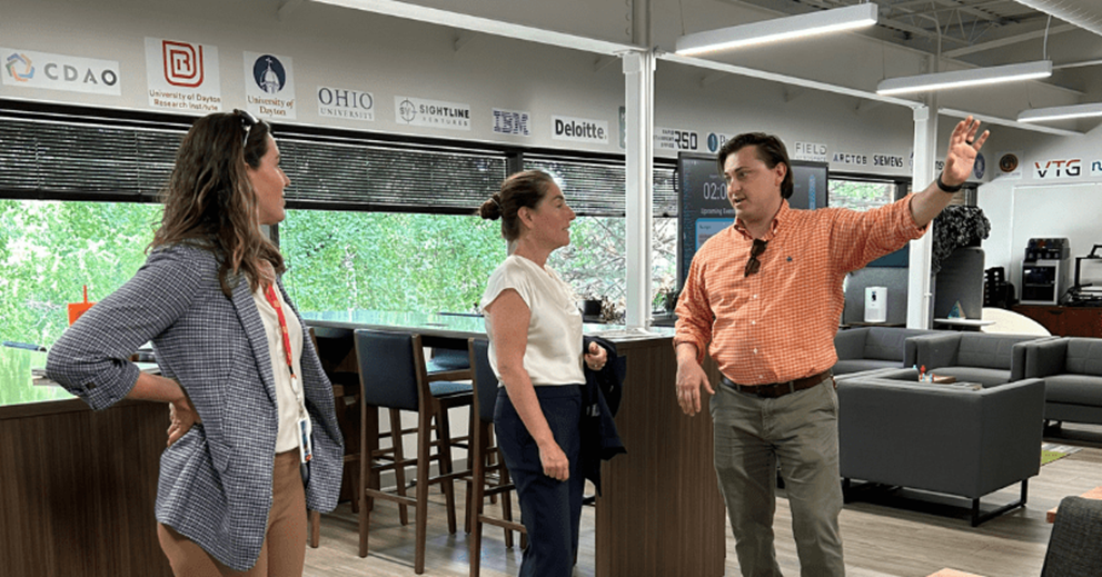 Hammack (center) learns about the Digital Transformation Center’s operations with Bryan Stewart (right) and workforce development director Kristy Fairfax (left).