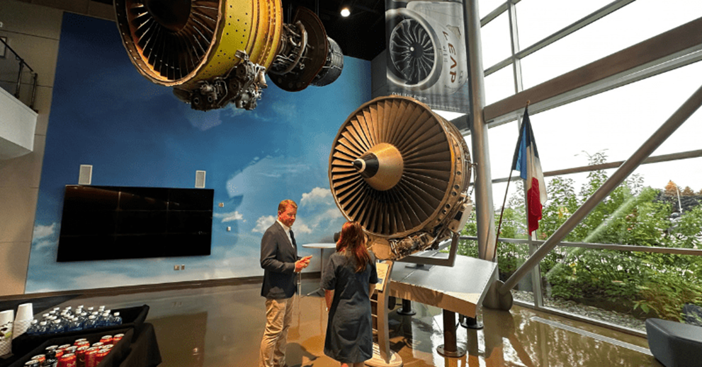 Beth Hammack, president and CEO of the Federal Reserve Bank of Cleveland (right) tours the GE Aerospace facility with the company’s head of government affairs and policy, Pete Giambastiani.