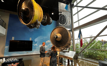 Beth Hammack, president and CEO of the Federal Reserve Bank of Cleveland (right) tours the GE Aerospace facility with the company’s head of government affairs and policy, Pete Giambastiani.