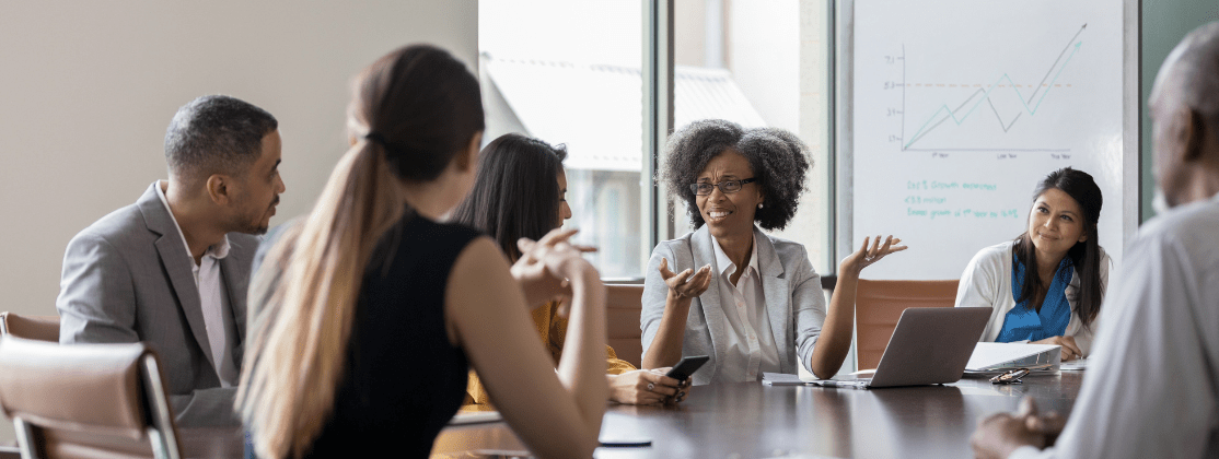 A group of people meeting in a conference room.