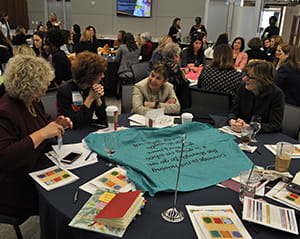 Conference participants engage in a breakout session discussion.