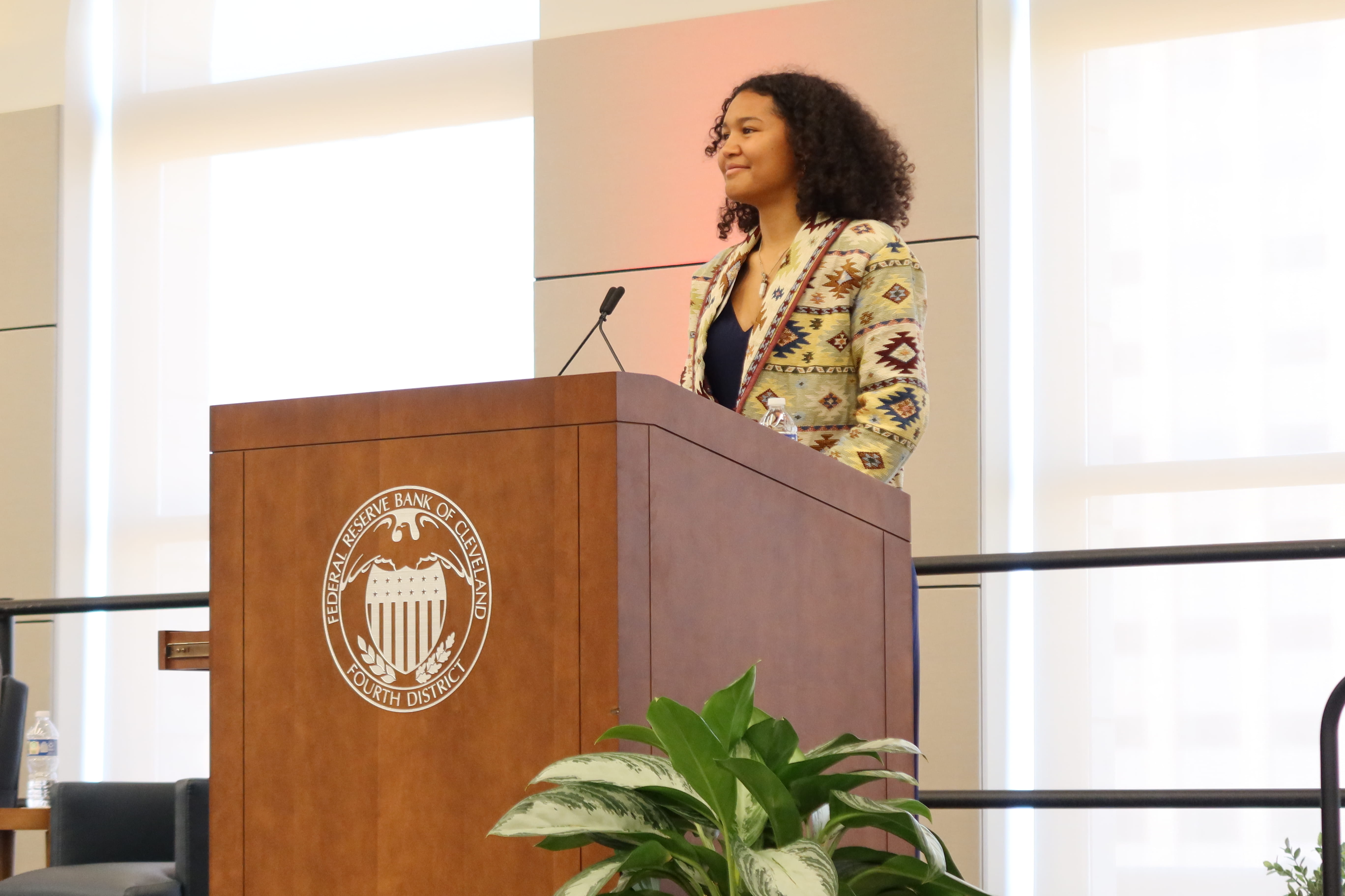 Student presenting at podium