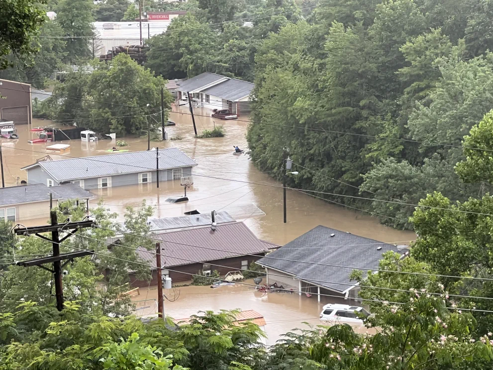 Rescue teams use kayaks to search for residents trapped by the flood in Whitesburg, Kentucky.