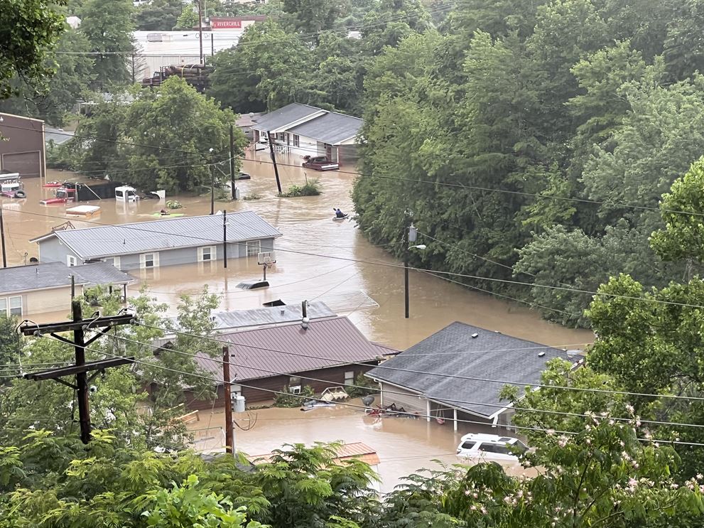 Rescue teams use kayaks to search for residents trapped by the flood in Whitesburg, Kentucky.