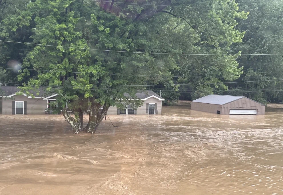A flooded home and garage in Letcher County, Kentucky.